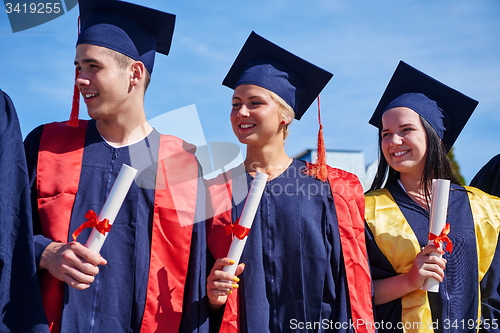 Image of young graduates students group