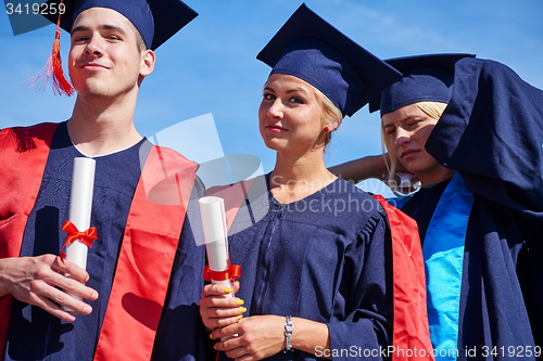 Image of young graduates students group