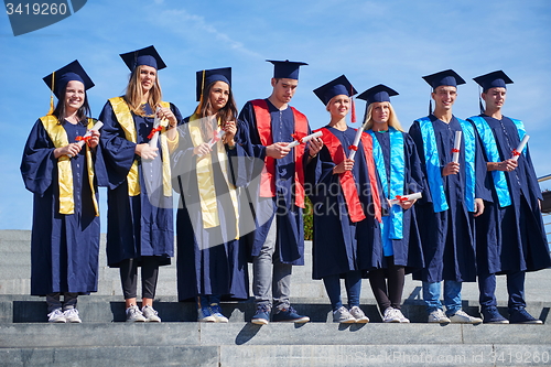 Image of young graduates students group