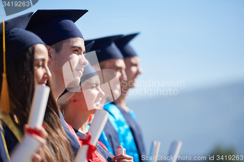 Image of young graduates students group