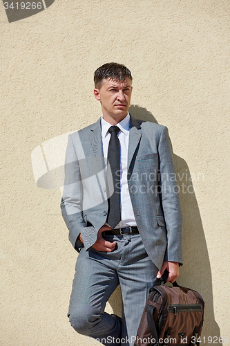 Image of senior  businessman outdoors