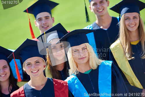Image of young graduates students group