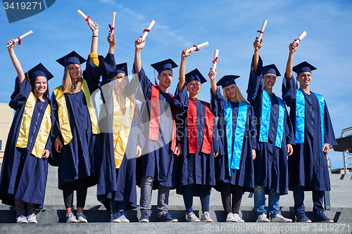 Image of young graduates students group