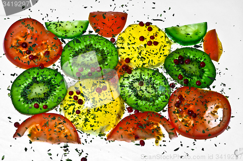 Image of Vegetable composition slices with tomatoes and kiwi