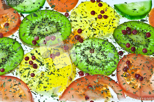 Image of Vegetable composition slices with tomatoes and kiwi