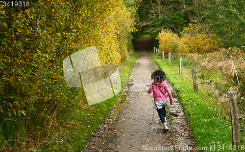 Image of Girl running in a path in the nature