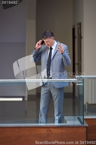 Image of business man using phone