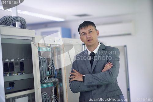 Image of network engineer working in  server room