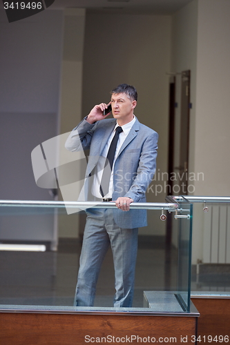 Image of business man using phone