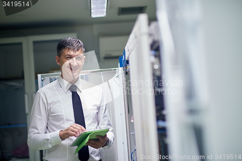 Image of network engineer working in  server room