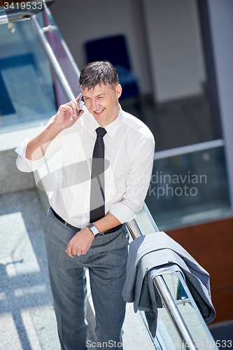 Image of business man using phone