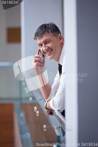 Image of business man using phone