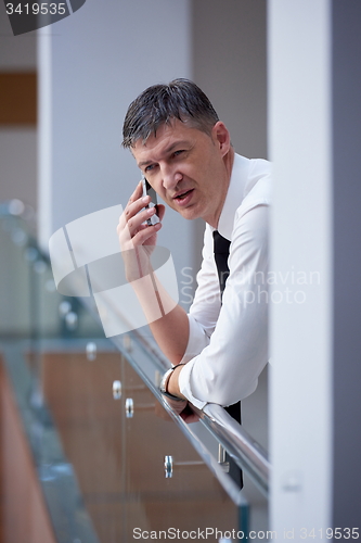 Image of business man using phone