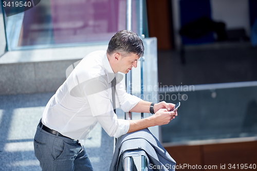 Image of business man using phone