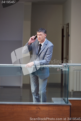 Image of business man using phone