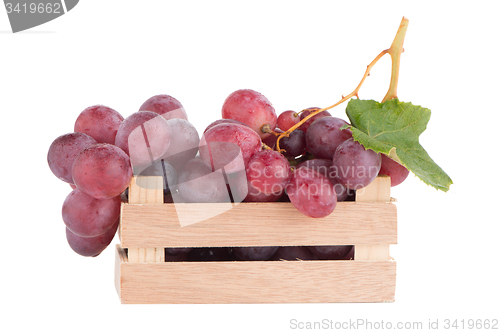 Image of Red grapes in wooden crate