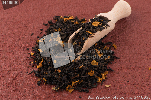 Image of Black Dry Tea with a Wooden Spoon