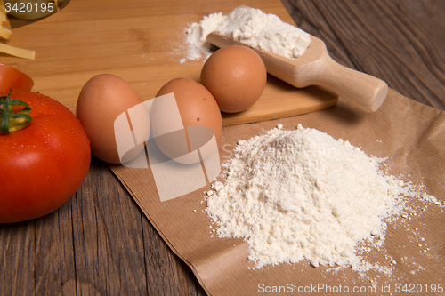 Image of Flour spoon and eggs