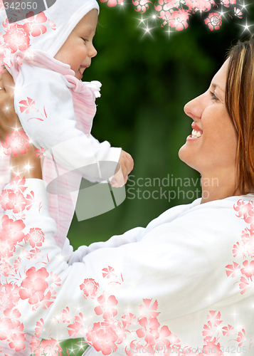 Image of happy mother with baby and flowers