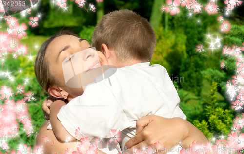 Image of happy mother and son with flowers