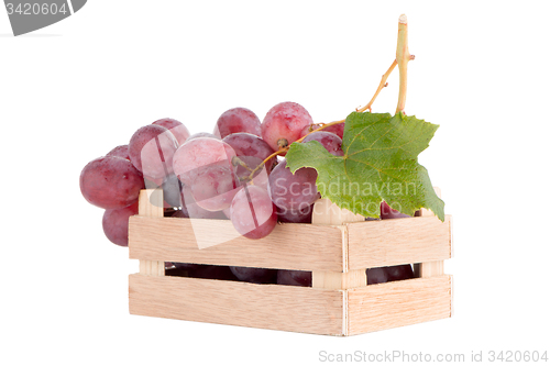 Image of Red grapes in wooden crate