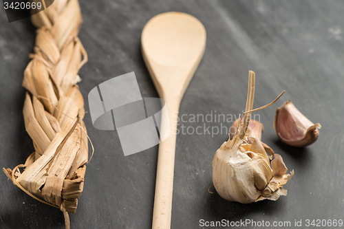 Image of Wooden spoon and garlic 