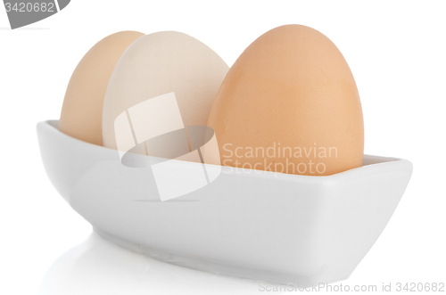 Image of Brown eggs in white ceramic bowl