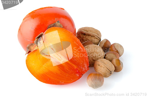 Image of Ripe persimmons and nuts