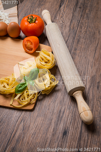 Image of Raw pasta, tomato and eggs