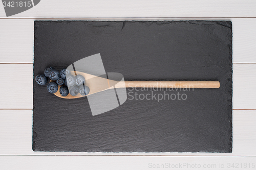 Image of Blueberries on a wooden spoon