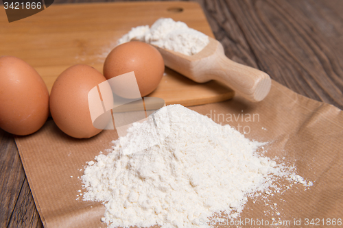 Image of Flour spoon and eggs
