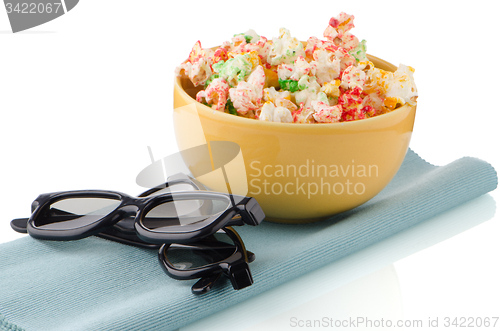 Image of Bowl of popcorn and 3D movie glasses