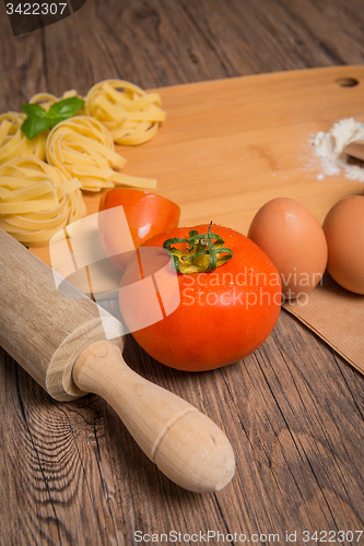 Image of Raw pasta, tomato and eggs