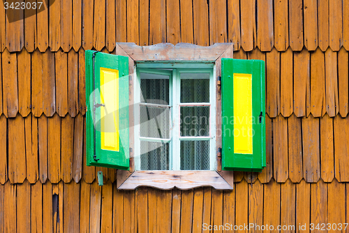 Image of Colorful vintage wooden window shutters.