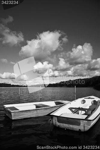 Image of Colorful boats on a lake with cloudy blue sky in Denmark