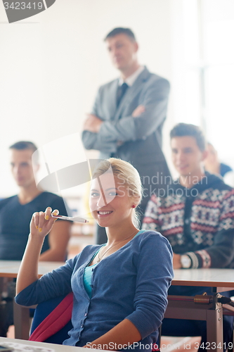 Image of group of students with teacher on class