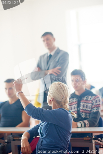 Image of group of students with teacher on class