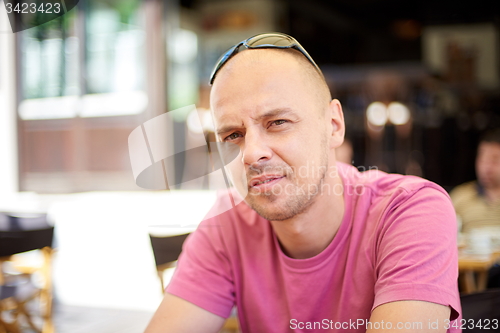 Image of portrait of young man on coffee break