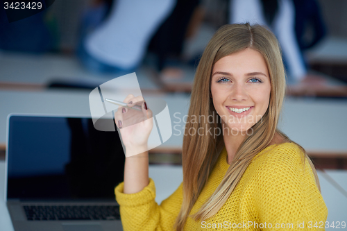 Image of portrait of happy smilling student girl at tech classroom