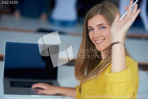 Image of portrait of happy smilling student girl at tech classroom