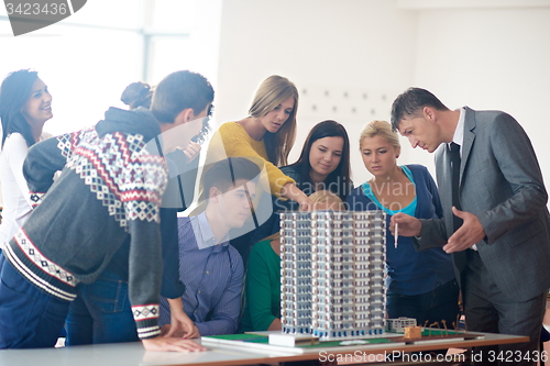 Image of group of students with teacher on class