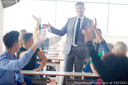 Image of group of students with teacher on class