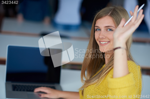 Image of portrait of happy smilling student girl at tech classroom
