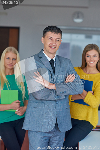 Image of group portrait of teacher with students