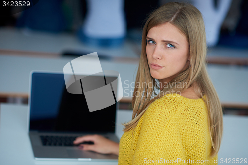 Image of portrait of happy smilling student girl at tech classroom