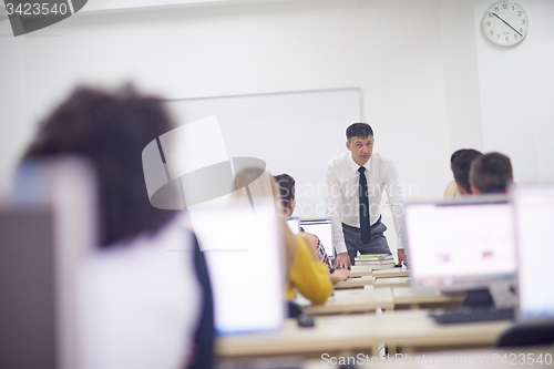 Image of students with teacher  in computer lab classrom