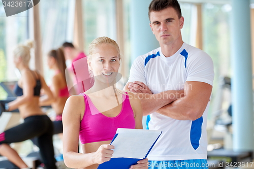 Image of people group in fitness gym