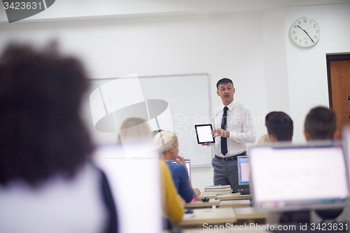 Image of students with teacher  in computer lab classrom