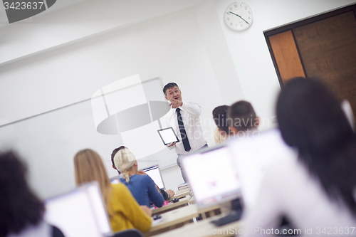 Image of students with teacher  in computer lab classrom