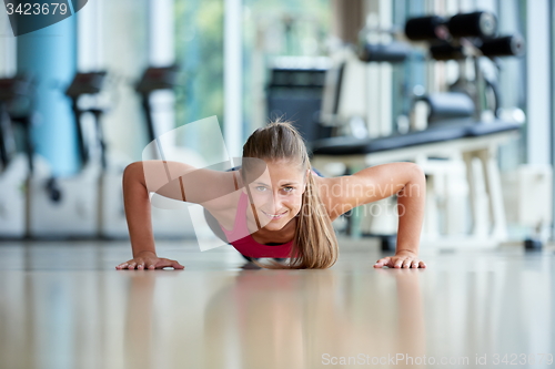 Image of warming up and doing some push ups a the gym